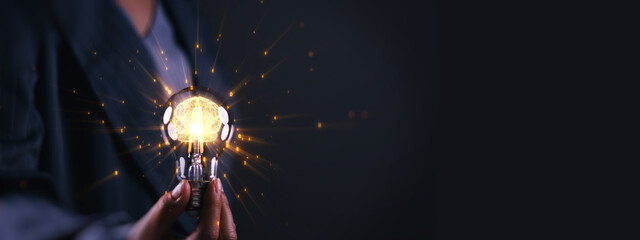 AI innovation concept with a glowing light bulb revealing digital brain, held by business professional, symbolizing artificial intelligence, creativity, insight, strategy, future technology solutions.