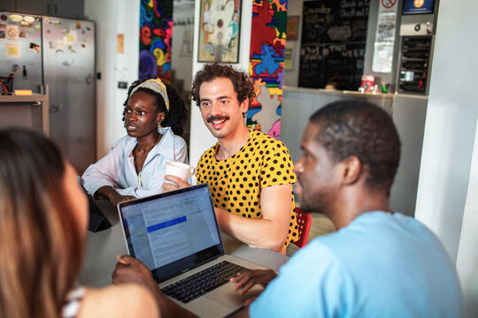 Diverse team collaborating in creative coworking office