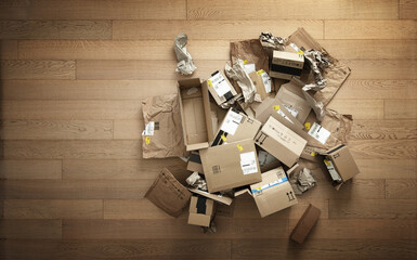 Boxes and cardboard packaging for online shopping piled up on wooden plank floor. Top view, space for text.