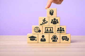 Education and career development concept with learning, teamwork and growth icons on wooden block