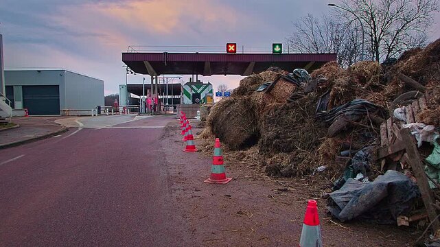 Semur-en-Auxois, FRANCE - JANUARY 16, 2026: Agricultural debris and soil cleared from A6 highway exit 23 following French farmers' protest. Road access restored after blockade at toll booth.
