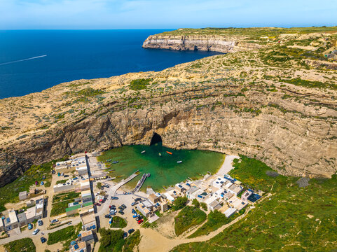 The Inland Sea, Dwejra is a lagoon of seawater on the island of Gozo. Aerial view of Sea Tunnel near Azure window. Malta 