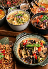 many different thai food dishes on table in modern restaurant in bangkok thailand