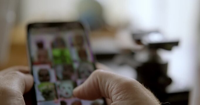 Man flipping through mobile phone. High quality 4k footage