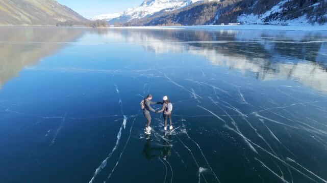 An IceSkating KISS on Crystal Clear Ice | Frozen Sils Lake, Switzerland