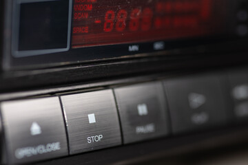 Closeup Of CD Player Stop Button On Metallic Dashboard Control Panel