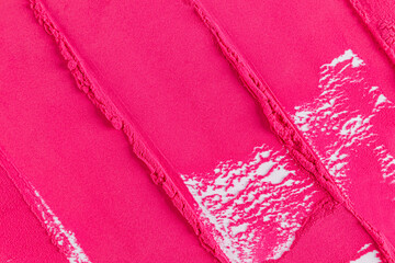 Beautiful cosmetic background in bright pink. Decorative blush texture in a rich pink tone. A sample of decorative cosmetics. A copy of the space.