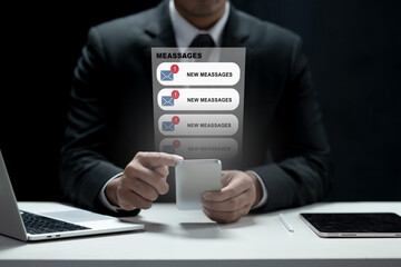 Professional businessman in a suit using a smartphone with virtual message notifications and alerts appearing. Concept of digital communication, technology, and business productivity