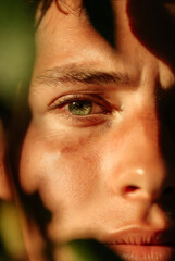 Young man up to the top of mountain. Man on the rock. Hiking to the mountain