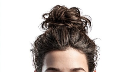 Fototapeta premium Close-up of a woman's messy bun hairstyle against a clean white background