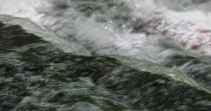 The babbling brook flows over the rocks