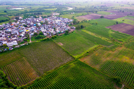 Aerial view of village and agriculture field, India.