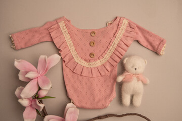Newborn clothes with toys and flowers in a beautifully folded position for a photo © VideofotKA