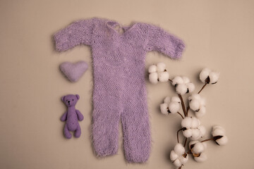 Newborn clothes with toys and flowers in a beautifully folded position for a photo © VideofotKA