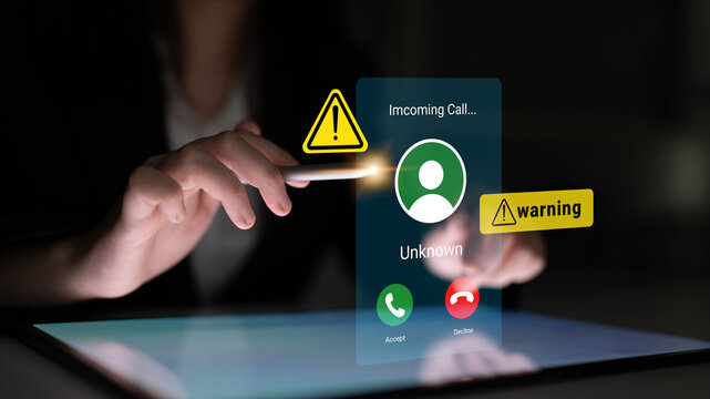 A close-up view of a mobile device displaying an incoming call labeled as "Unknown," featuring warning alerts to emphasize the need for caution in communication. Gantry - Powered by Adobe