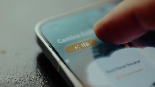 Person using a finger to tap a button labeled Ifa