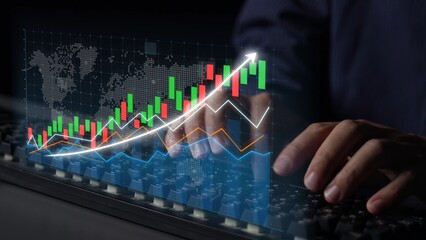 A close-up view of a keyboard with hands actively engaged while vibrant financial charts illustrate growth and market dynamics in a digital setting. Copula