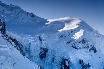 Mighty snow-capped Mont Blanc massif with glacier in winter. The highest peak in Europe, a four-thousander in the Alps, Chamonix-Mont-Blanc, France.