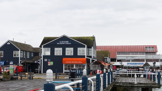Lavash Seaside Grill restaurant, Steveston Village, Richmond, British Columbia, Canada- 1 Oct 2025:  seafood restaurant at the pier in the historic tourist site on a cloudy day with copy space