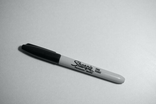 Black Sharpie felt pen marker on light background