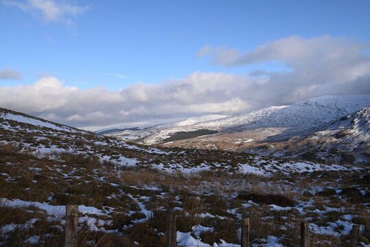 a view walking up a snowy Cadair Idris in south Gwynedd, wales from the mach loop