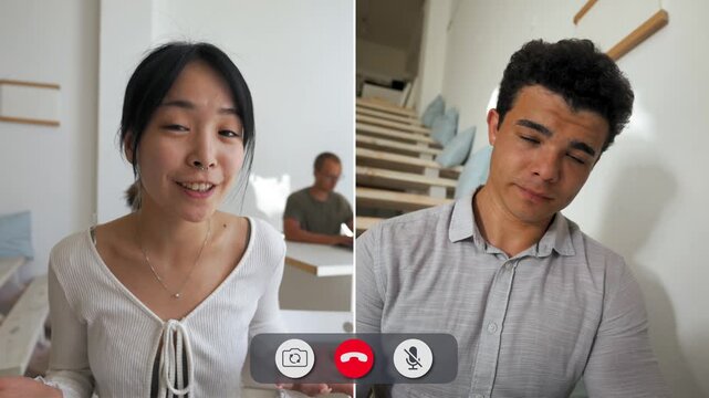 A man looks bored during an online call with two people. They share ideas while he seems uninterested. The background shows a staircase and a light setting.