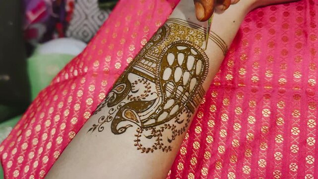 A close-up of an Indian woman's hand decorated with henna mehendi designs, captured during the festival. stock video footage.