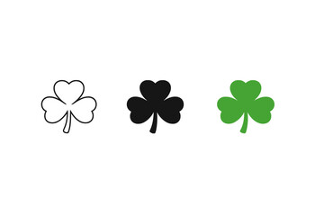 Fototapeta premium Glowing green shamrock icon emerging from darkness with grey and black clover silhouettes on a blurred gradient background, minimalist lucky symbol