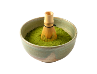 Traditional bamboo whisk rests inside a rustic ceramic bowl filled with vibrant green matcha powder, an essential set for a classic tea ceremony preparation