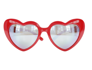 Red heart-shaped novelty sunglasses with a glossy plastic frame and reflective mirrored lenses showing a bright empty room with windows