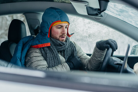Cold man stuck in electric car during winter storm