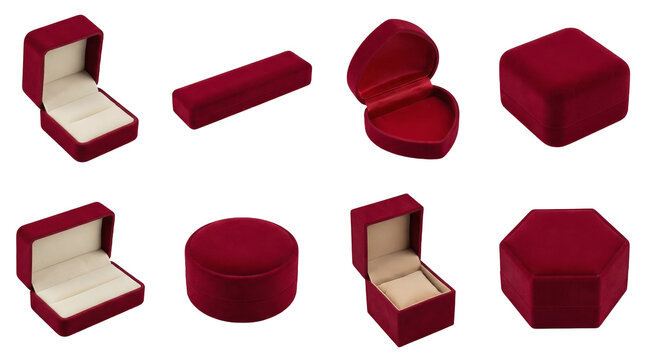 Red velvet jewelry box set including ring, necklace, earring, watch, and heart shaped containers isolated. Elegant gift packaging collection.