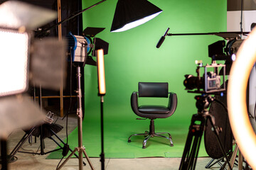 Empty film studio set with green screen and production equipment
