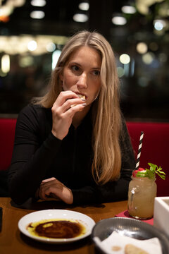 young woman in cafe with coffee