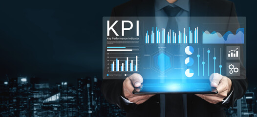 A businessman showcases a high-tech digital interface displaying KPI data analysis with various graphs and charts. The futuristic city skyline sets an inspiring backdrop. Gantry