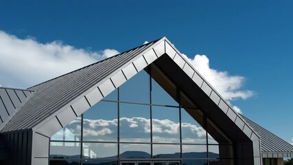 Modern architectural building with angular roof and glass windows - Powered by Adobe