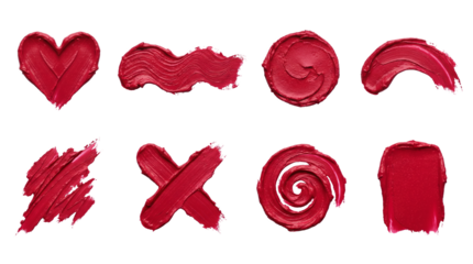 Deep red lipstick swatch set including heart, wave, spiral, cross, and abstract strokes isolated. Cosmetic cream texture and beauty makeup collection.