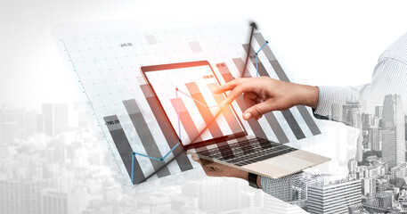 A businessman analyzing financial data on a laptop, showcasing graphs and cityscape overlay, capturing the essence of modern business analysis and technology. Impute