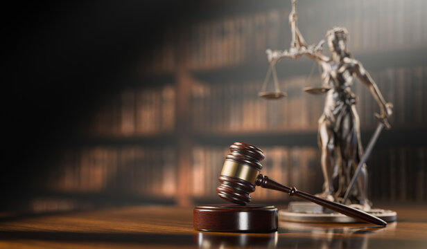 Legal Concept: Themis is the goddess of justice and the judge's gavel hammer as a symbol of law and order on the background of books