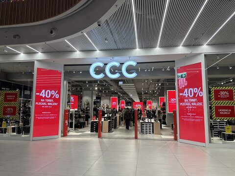 Warsaw, Poland - December 18, 2025: CCC store entrance with bright red sale signs showcasing discounts, inviting shoppers into a modern retail environment with stylish displays
