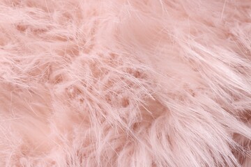Obraz premium Texture of pink fluffy fabric as background, closeup