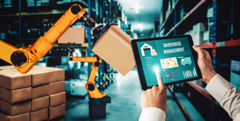 Smart robot arm systems for innovative warehouse and factory digital technology . Automation manufacturing robot controlled by industry engineering using IOT software connected to internet network .