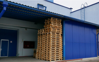 Pallets in a stack in a production warehouse