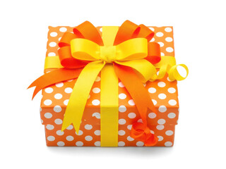 Brightly wrapped gift box with polka dots and ribbons