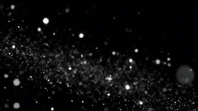 A dynamic stream of bright, sparkling white particles flowing against a deep black background.