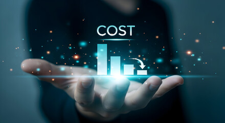 Hand holding digital graph showing decreasing cost with bar chart and downward trend arrow clearly visible
