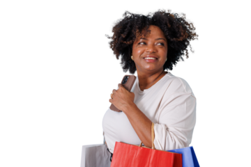 Happy black woman holding smartphone and shopping bags, looking away smiling on transparent background