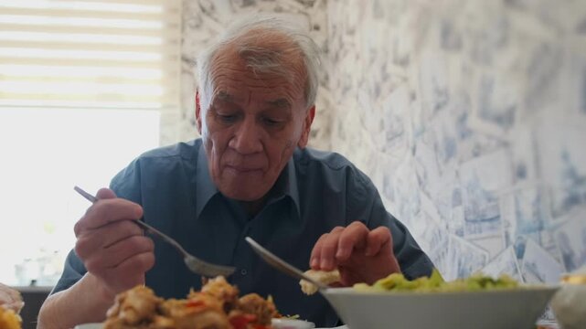 Elderly Man Dining Quietly - Older Gentleman Eating Peacefully Now - Gentle Aged Man Pauses During Tranquil Lunchtime - Serene Senior Man Takes Moment To Reflect While Enjoying His Peaceful Meal