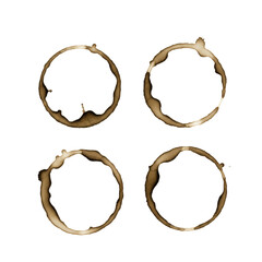 Four circular dried dark sepia coffee stains with splashes and irregular edges, isolated on a clean bright white matte background, top-down macro shot. Concept of grunge aesthetic texture