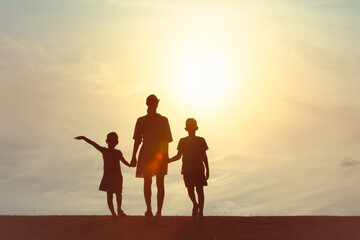 Fototapeta premium Parent Mother and Children Bonding at Golden Hour sunset 